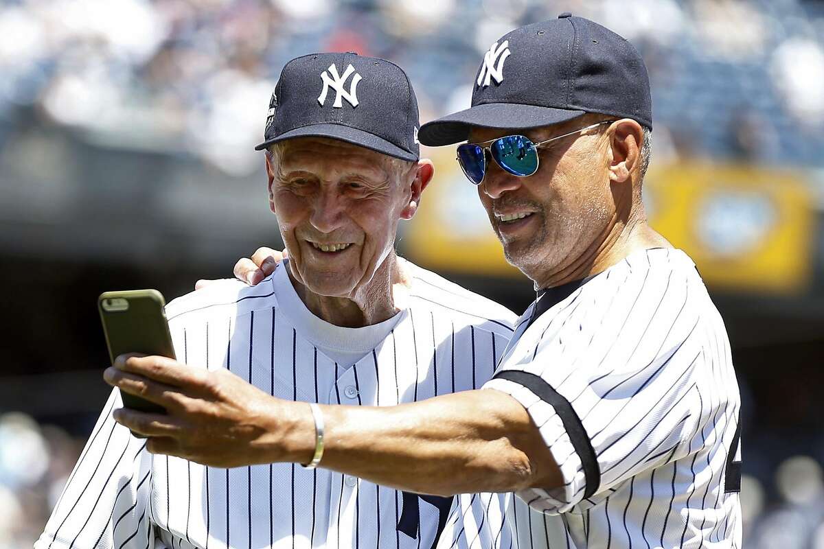 NEW YORK, NY - JUNE 17: Former players Dr.�Bobby Brown and Reggie Jackson of the New York Yankees take a selfie during the New York Yankees 72nd Old Timers Day game before the Yankees play against the Tampa Bay Rays at Yankee Stadium on June 17, 2018 in the Bronx borough of New York City. (Photo by Adam Hunger/Getty Images)
