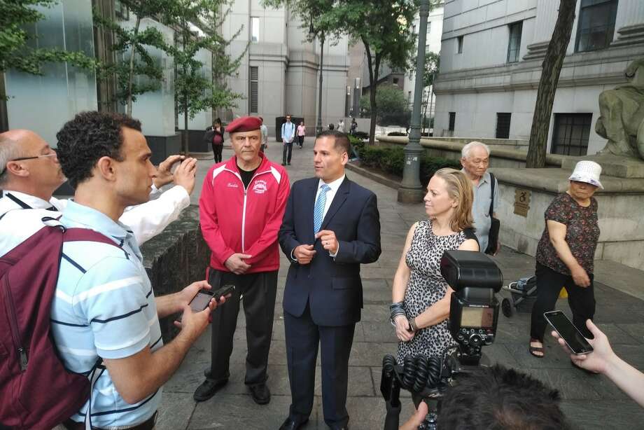 Republican gubernatorial candidate Marc Molinaro, center, is joined by Republican Lt. governor candidate Julie Killian, right, and New York State Reform Party Chairman Curtis Sliwa,left, outside the Manhattan Federal Courthouse on Monday, June 18, 2018. (Campaign Photo) Photo: Campaign Photo,  Provided