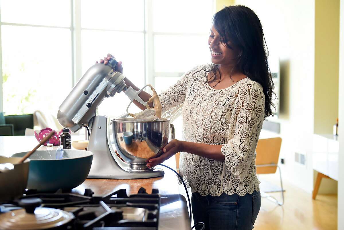 Just Date Syrup creator Sylvie Charles uses a mixer while making tahini-date chocolate chip cookies at her home in San Francisco, Calif., on Tuesday June 12, 2018.
