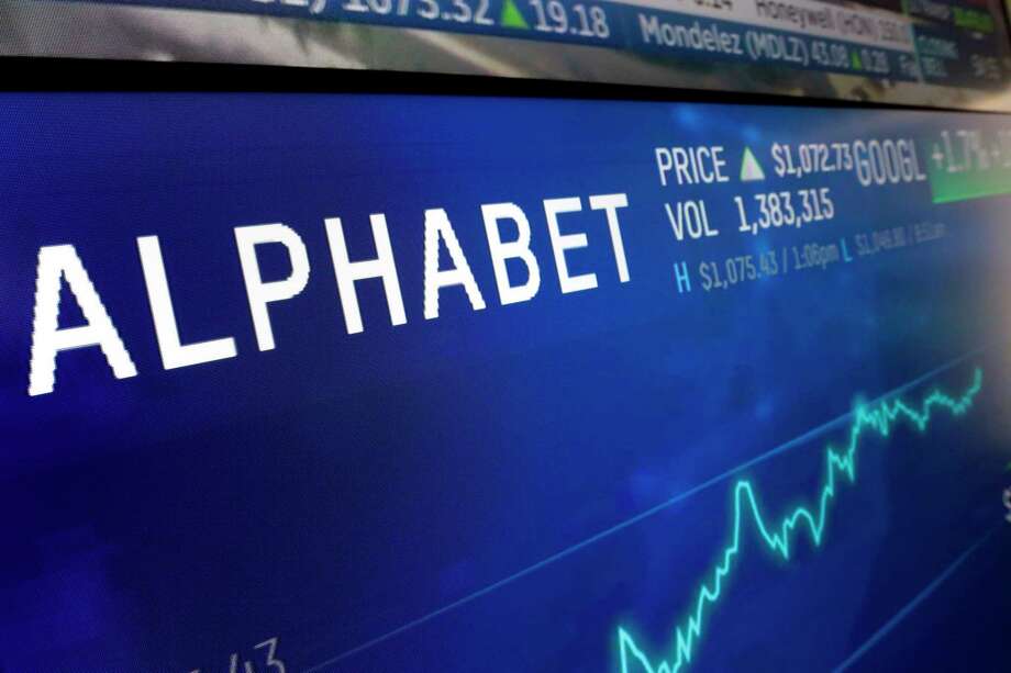 FILE- In this Feb. 14, 2018, file photo the logo for Alphabet appears on a screen at the Nasdaq MarketSite in New York. Google parent Alphabet Inc. has rejected several shareholder proposals aimed at linked executive pay to diversity goals, being more open about its lobbying expenses, narrowing the gender pay gap, and weakening the grip founders Larry Page and Sergey Brin have on company voting stock. (AP Photo/Richard Drew, File) Photo: Richard Drew / Copyright 2018 The Associated Press. All rights reserved.