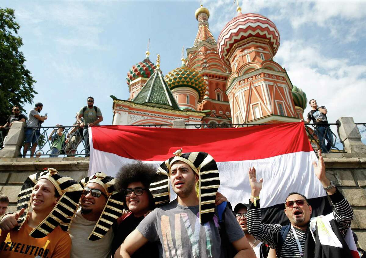 Egypt supporters cheer outside the Kremlin, in Moscow, on June 17, 2018, during the Russia 2018 World Cup football tournament. / AFP PHOTO / Maxim ZMEYEVMAXIM ZMEYEV/AFP/Getty Images
