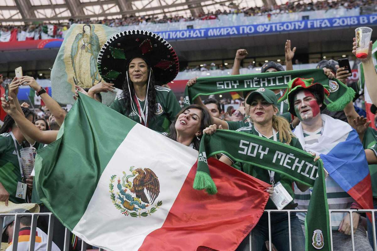 Mexico supporters pose after their team won the Russia 2018 World Cup Group F football match between Germany and Mexico at the Luzhniki Stadium in Moscow on June 17, 2018. / AFP PHOTO / Juan Mabromata / RESTRICTED TO EDITORIAL USE - NO MOBILE PUSH ALERTS/DOWNLOADSJUAN MABROMATA/AFP/Getty Images