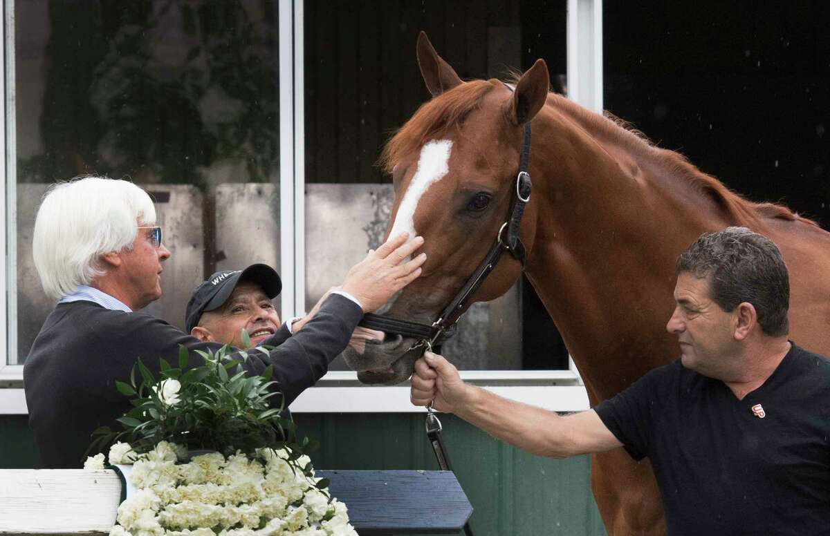 Justify gets his day with the media Sunday June 10, 2018 after he won the Triple Crown by winning the 150th running of The Belmont Stakes at Belmont Park in Elmont, N.Y. Justify stands by trainer Bob Baffert left and his regular jockey 52 year old Mike Smith, center and assistant trainer Jim Barnes, right. (Skip Dickstein/Times Union)