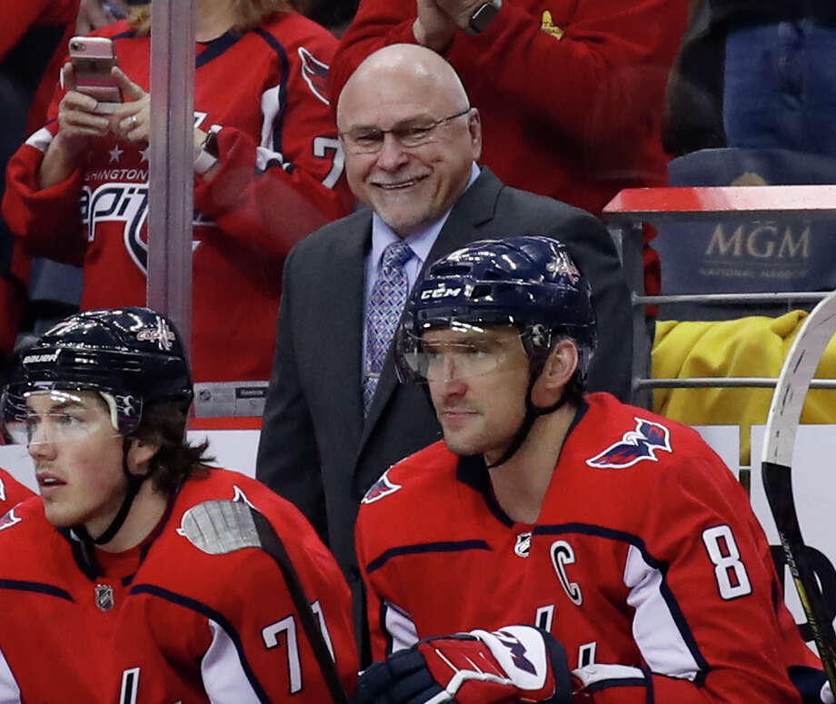 FILE - In this March 12, 2018, file photo, Washington Capitals head coach Barry Trotz smiles towards left wing Alex Ovechkin, right, after Ovechkin's goal in the second period of an NHL hockey game against the Winnipeg Jets, in Washington. Trotz has resigned as coach of the Washington Capitals after leading them to the Stanley Cup.  The team announced Trotzs resignation Monday, June 18, 2018. (AP Photo/Alex Brandon, File) Photo: Alex Brandon / Copyright 2018 The Associated Press. All rights reserved.