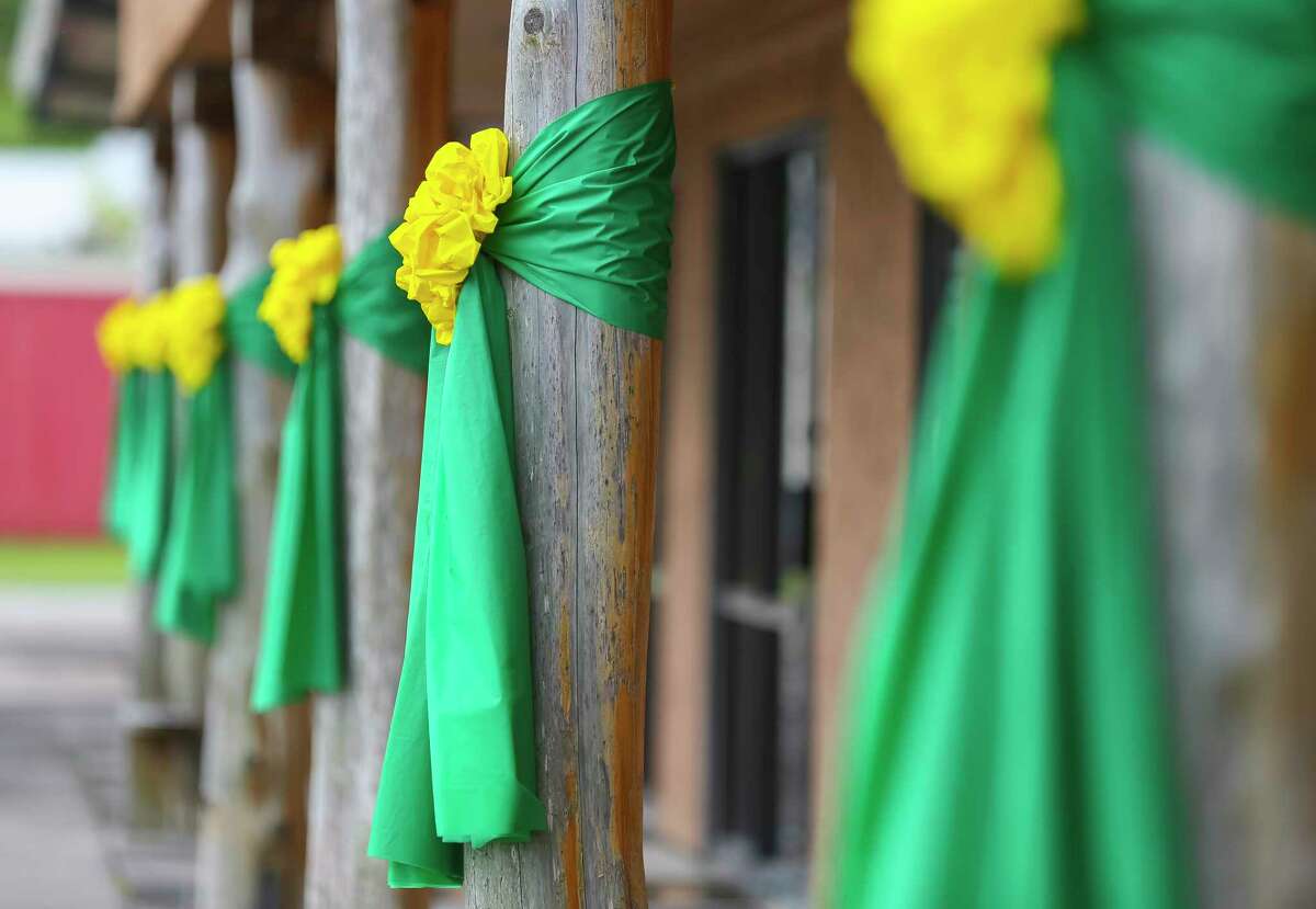 Green and yellow ribbons are tied to columns in front of the Santa Fe Chamber of Commerce along Highway 6, Monday, June 18, 2018 in Santa Fe.