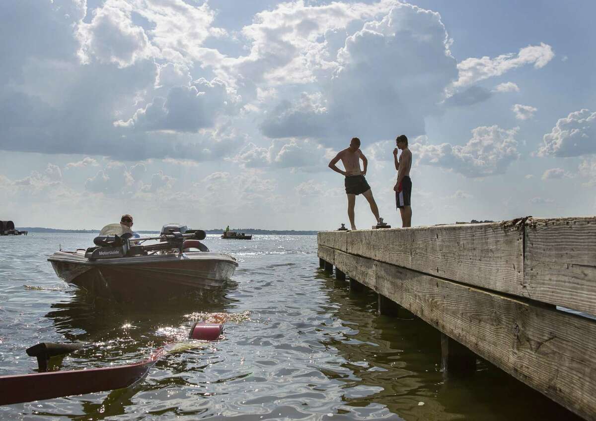 Chris Wallace, of Cold Spring, steers his boat onto its trailer at the public boat launch at the end of County Road 830 on Lake Conroe, Wednesday, June 13, 2018, in Willis. Wallace comes to Lake Conroe to fish twice a week during the summer time. ( Mark Mulligan / Houston Chronicle )