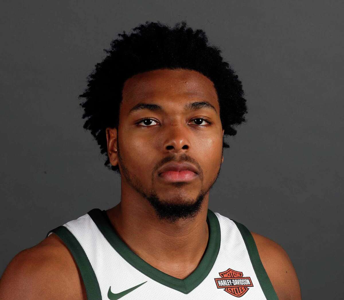 FILE - In this Sept. 25, 2017, file photo, Milwaukee Bucks' Sterling Brown poses for photos during NBA basketball team media day in Milwaukee. Newly released police videos showing the stun gun arrest of Bucks guard Sterling Brown show one officer stepping on Brown's ankle while he was handcuffed on the ground and others discussing the potential backlash of taking down an African American professional basketball player. Brown was arrested for a parking violation in Milwaukee in January.(AP Photo/Morry Gash, File)