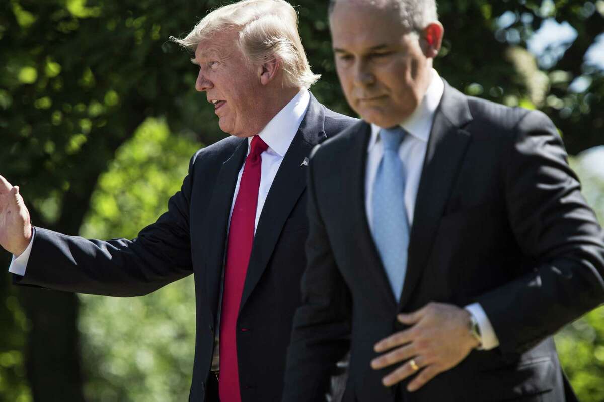 President Donald Trump and Environmental Protection Agency Administrator Scott Pruitt are shown together in June 2017. Despite facing a dozen ongoing probes into his spending and management decisions, Pruitt has continued to have the support of the president. Must credit: Washington Post photo by Jabin Botsford