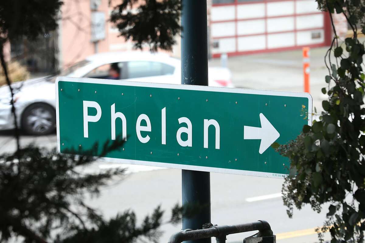View of a sign on Ocean Avenue directing where to turn for Phelan Avenue. Phelan Avenue signage has been replaced with signs designating Frida Kahlo Way.