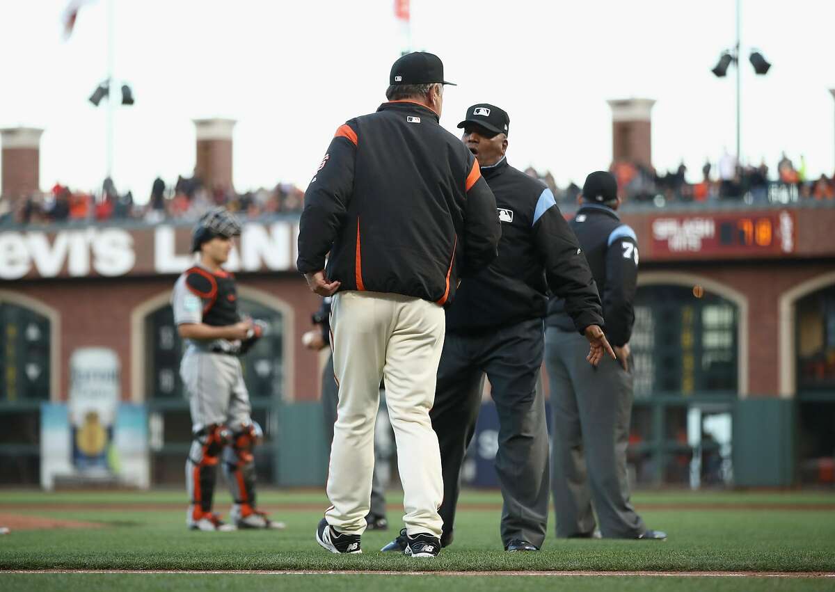SAN FRANCISCO, CA - JUNE 19: Manager Bruce Bochy of the San Francisco Giants argues with umpire Laz Diaz after Dan Straily #58 of the Miami Marlins hit Buster Posey #28 of the San Francisco Giants in the second inning at AT&T Park on June 19, 2018 in San Francisco, California. (Photo by Ezra Shaw/Getty Images)