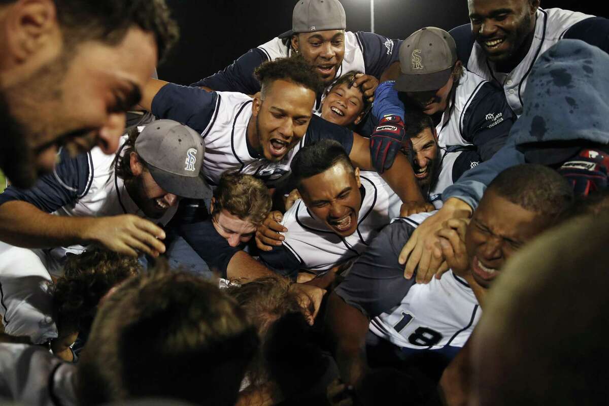The San Rafael Pacifics celebrate after winning a 2015 championship game