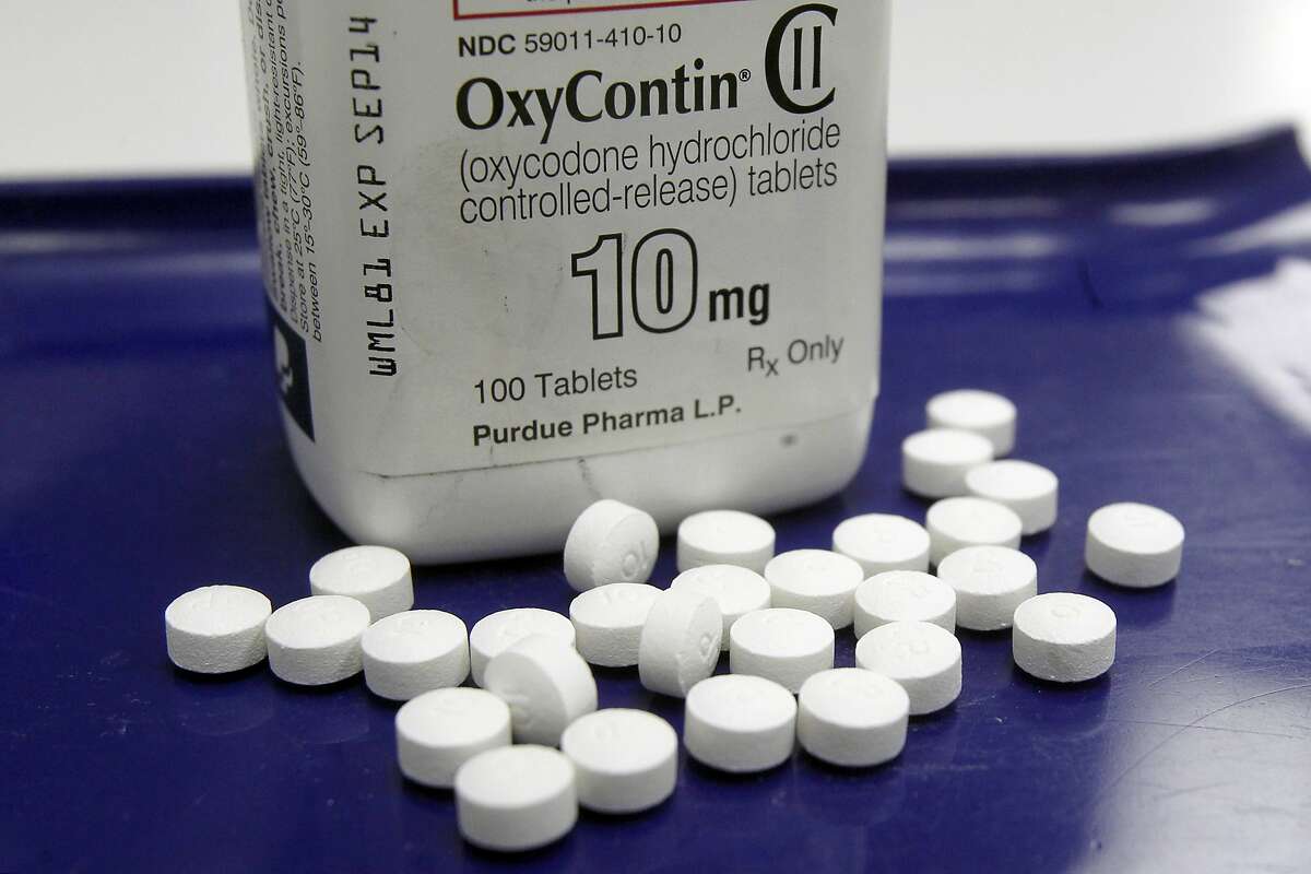 FILE - This Feb. 19, 2013, file photo shows OxyContin pills arranged for a photo at a pharmacy in Montpelier, Vt. Purdue Pharma, the maker of the prescription opioid painkiller OxyContin, is asking a judge in Alaska to dismiss a lawsuit that blames the company for the state's epidemic of opioid abuse. (AP Photo/Toby Talbot, File)