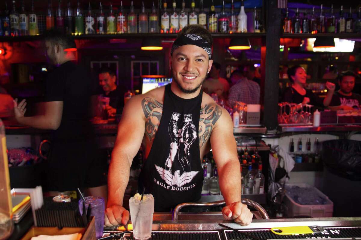 Gian Quiteno serves up drinks at The Eagle in Montrose.