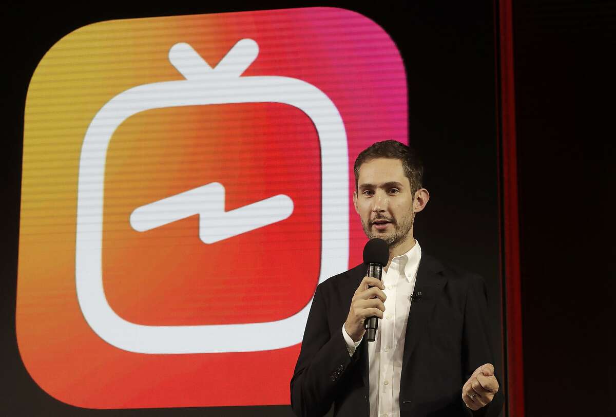 In this Tuesday, June 19, 2018, photo Kevin Systrom, CEO and co-founder of Instagram, prepares for Wednesday's announcement about IGTV in San Francisco. Facebook's Instagram app is loosening its restraints on video with a new channel that will attempt to lure younger viewers away from Google's YouTube and pave the way to sell more advertising. (AP Photo/Jeff Chiu)