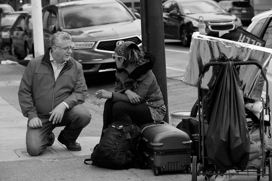 Jeff Kositsky (l to r), who leads the city�s homelessness department, talks with Angel Brown at a staging area for street counselors and doctors on Wednesday, April 25, 2018 in San Francisco, Calif. Photo: Lea Suzuki / The Chronicle