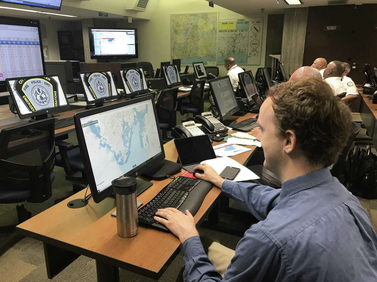 City employees, emergency personnel and others work in front of computer monitors in the Emergency Operations Center Wednesday as they participated in the 2018 Governor’s Emergency Planning and Preparedness Initiative exercise.