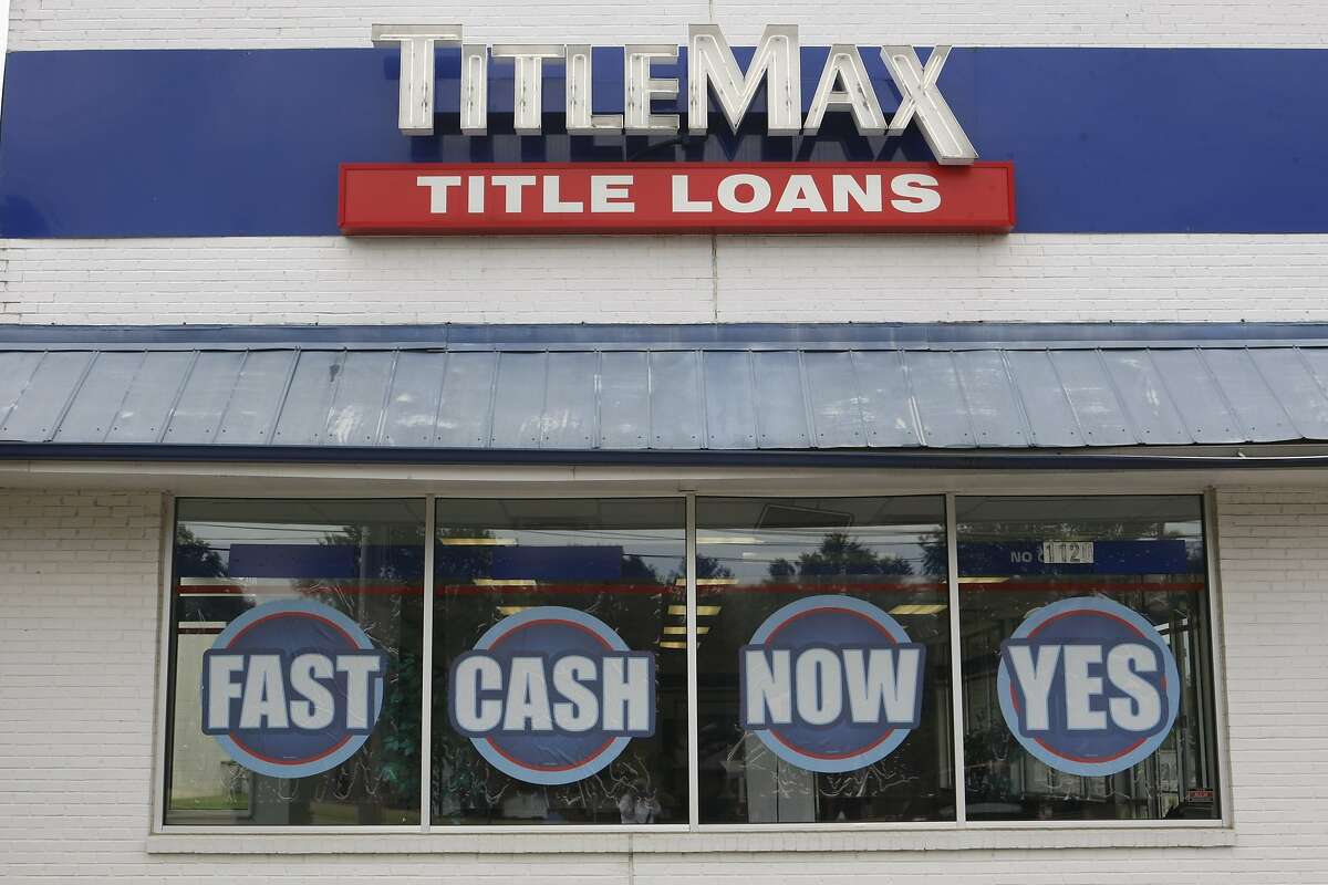 This May 31, 2016 photo shows a title loan company in Memphis, Tenn. From 2008 to 2014, for the typical or median U.S. household _ the midpoint between richest and poorest _ income fell 3 percent. For the bottom 20 percent, incomes plunged 6 percent during a time when the economy was mostly recovering. (AP Photo/Karen Pulfer Focht)