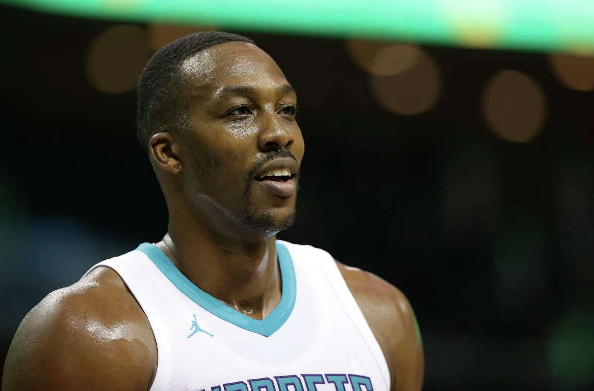 CHARLOTTE, NC - OCTOBER 13: Dwight Howard #12 of the Charlotte Hornets watches on against the Dallas Mavericks during their game at Spectrum Center on October 13, 2017 in Charlotte, North Carolina. NOTE TO USER: User expressly acknowledges and agrees that, by downloading and or using this photograph, User is consenting to the terms and conditions of the Getty Images License Agreement. (Photo by Streeter Lecka/Getty Images) ORG XMIT: 775026623