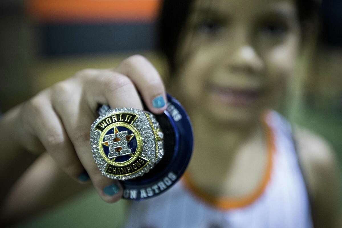 Marylin Basaldu, 5, shows off her replica World Series ring she received before the Houston Astros major league baseball game against the Tampa Bay Rays at Minute Maid Park on Wednesday, June 20, 2018, in Houston. ( Brett Coomer / Houston Chronicle )