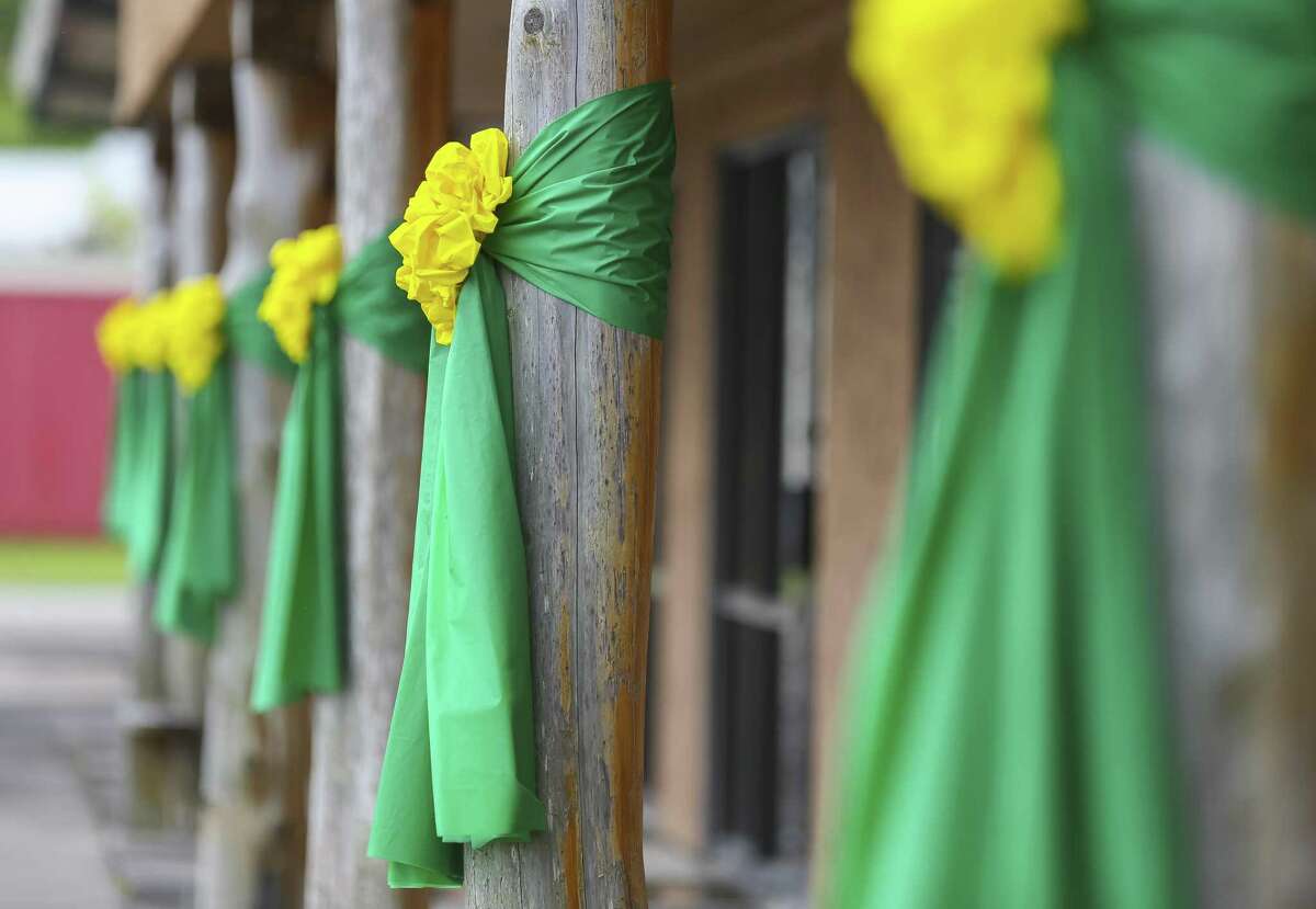 Green and yellow ribbons are tied to columns in front of the Santa Fe Chamber of Commerce along Highway 6, Monday, June 18, 2018 in Santa Fe. ( Mark Mulligan / Houston Chronicle )
