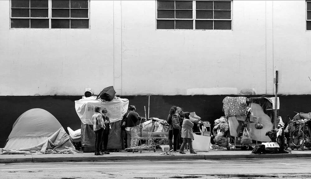 Homeless people on a sidewalk on Division St.