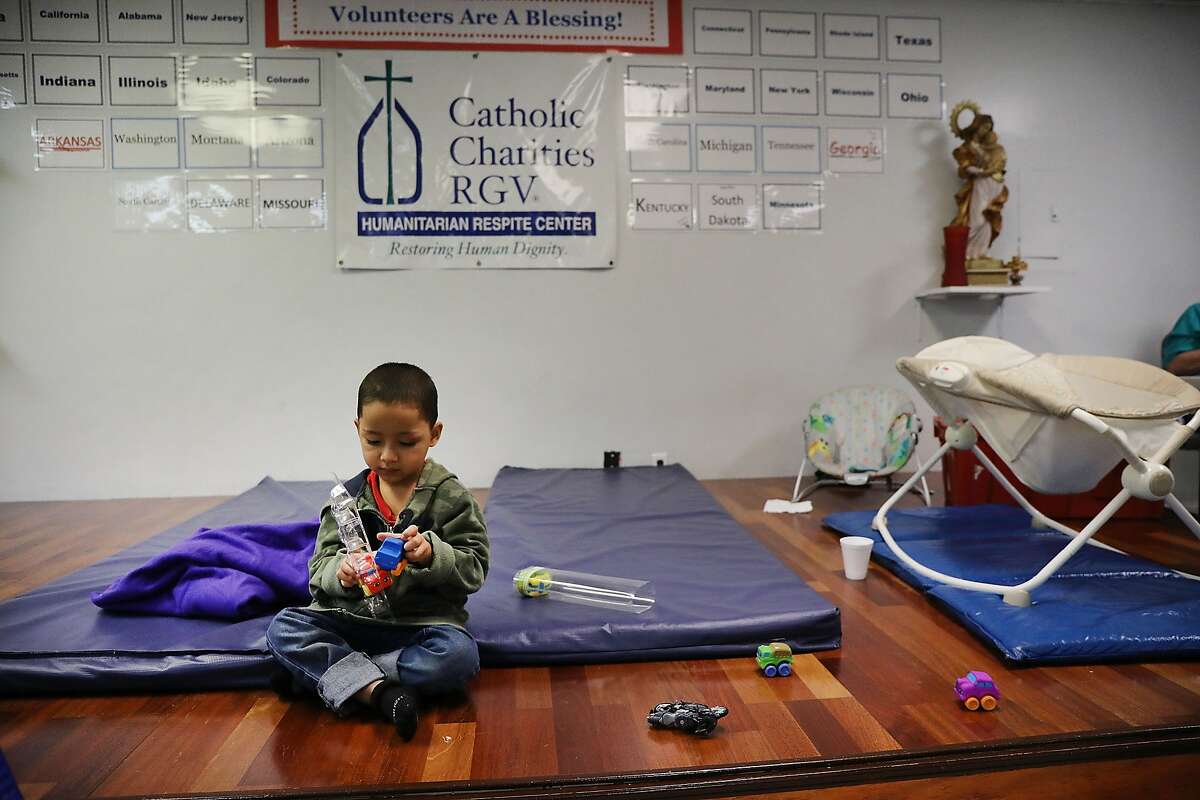 MCALLEN, TX - JUNE 21: A Honduran child plays at the Catholic Charities Humanitarian Respite Center after recently crossing the U.S., Mexico border with his father on June 21, 2018 in McAllen, Texas. Once families and individuals are released from Customs and Border Protection to continue their legal process, they are brought to the center to rest, clean up, enjoy a meal and get guidance to their next destination. Before Trump signed an executive order yesterday that the administration says halts the practice of separating families seeking asylum, more than 2,300 immigrant children had been separated from their parents in the zero-tolerance policy for border crossers. (Photo by Spencer Platt/Getty Images)