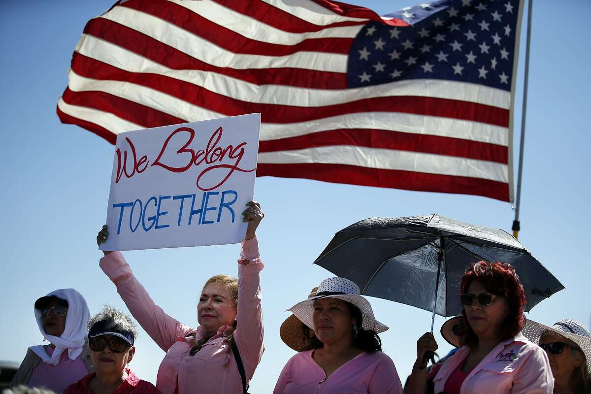 Activists demonstrate as a group of US mayors hold a press conference outside the holding facility for immigrant children in Tornillo, Texas, near the Mexican border, Thursday, June 21, 2018. About 20 mayors from cities across the country call for the immediate reunification of immigrant children with their families. (AP Photo/Andres Leighton)