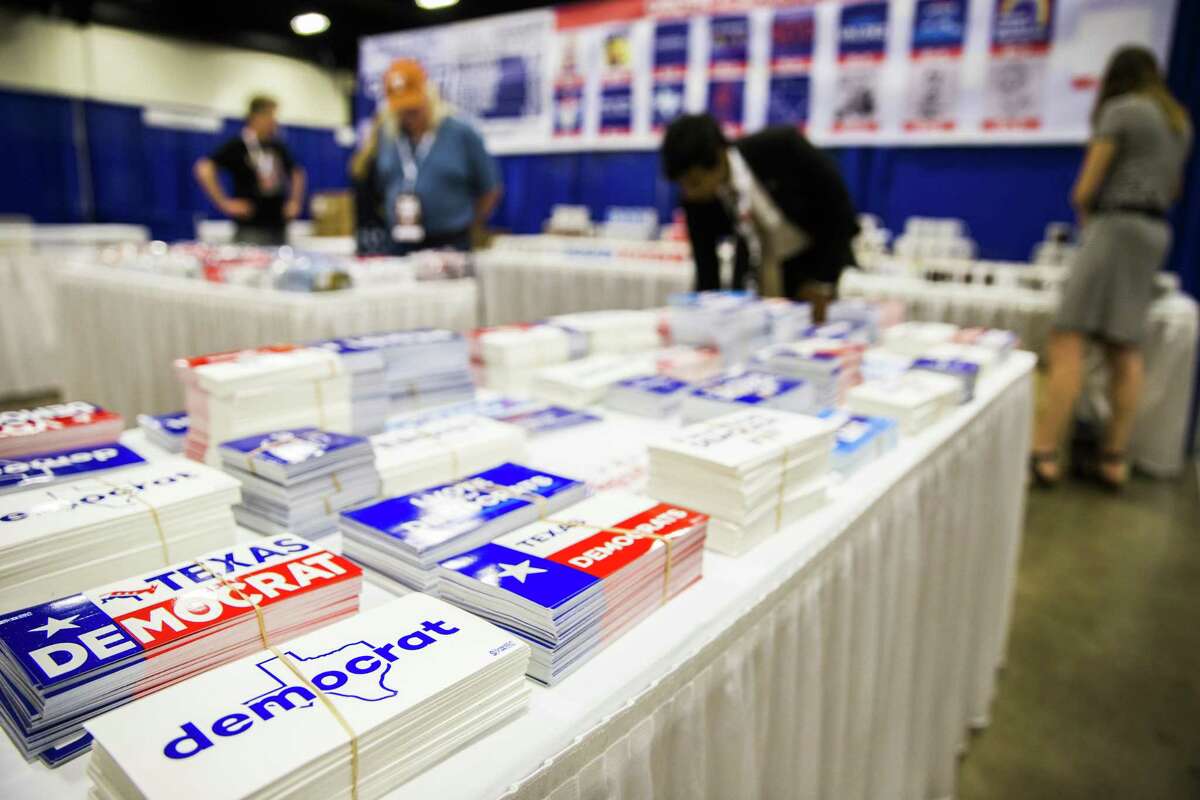 Workers set up a display of stickers, buttons and mugs as they prepare for the Texas Democratic Convention on Thursday, June 21, 2018 at the Fort Worth Convention Center in Fort Worth. (Ashley Landis/The Dallas Morning News)