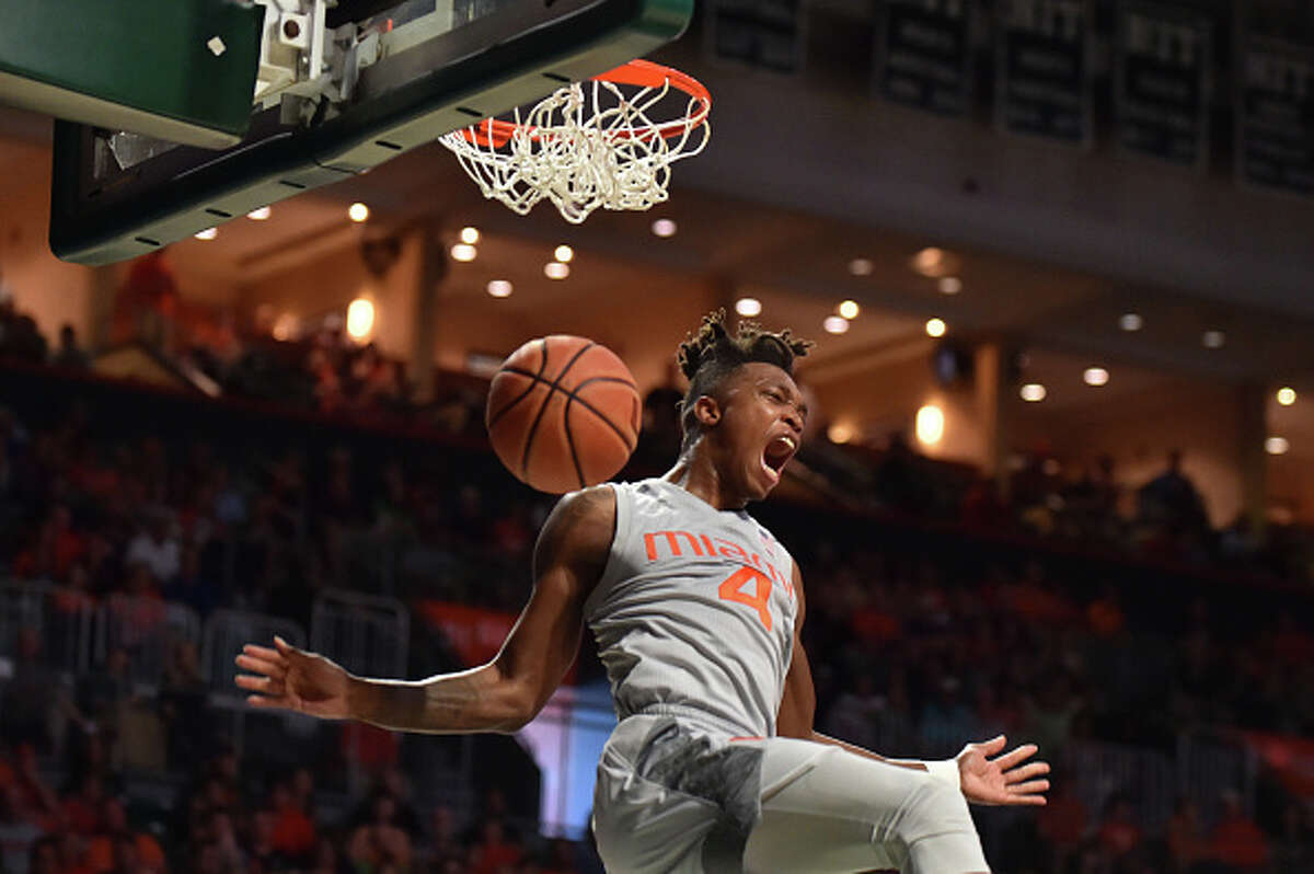 Lonnie Walker IV #4 of the Miami Hurricanes reacts after dunking the basketball during the second half of the game against the Syracuse Orange at The Watsco Center on February 17, 2018 in Miami, Florida. (Photo by Eric Espada/Getty Images)