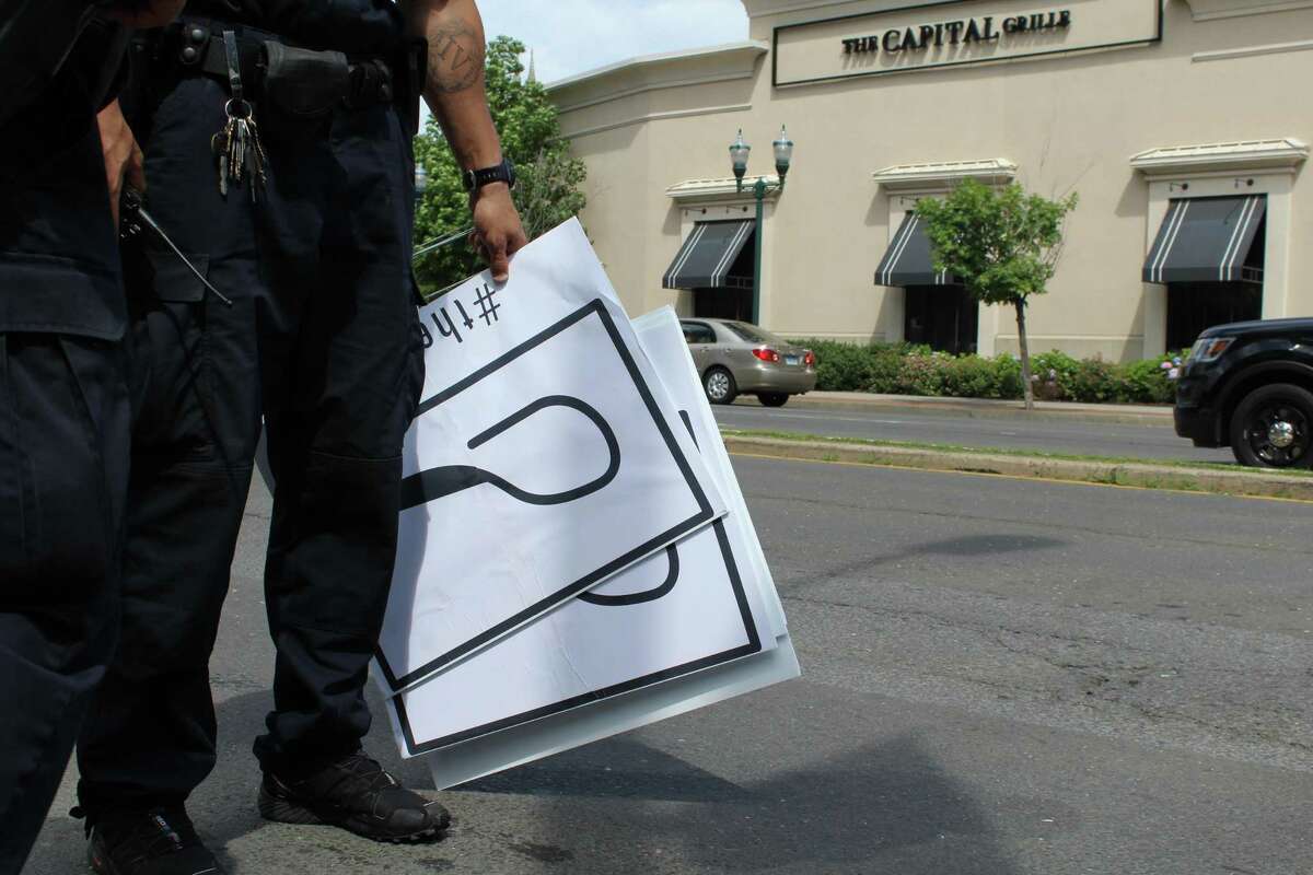 Protesters place giant heroin spoon outside Stamford’s Purdue Pharma