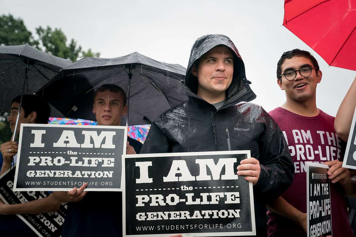Activists with Students for Life in America, a group opposed to abortion, demonstrate outside the U.S. Supreme Court in Washington, June 22, 2018. (Erin Schaff/The New York Times)