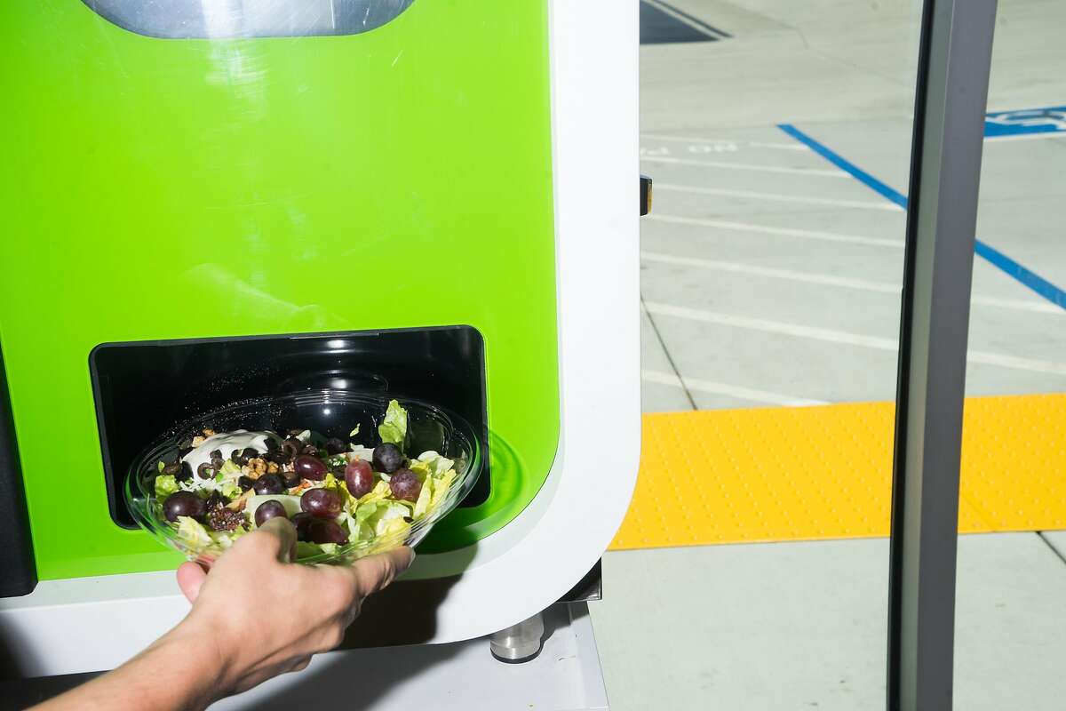 Jose Galvao of Chowbotics demonstrates how Sally, a salad-making robot, prepares salads at the Loop Neighborhood Market in Mountain View, Calif. on Thursday, June 21, 2018. Sally can make custom salads in under one minute.