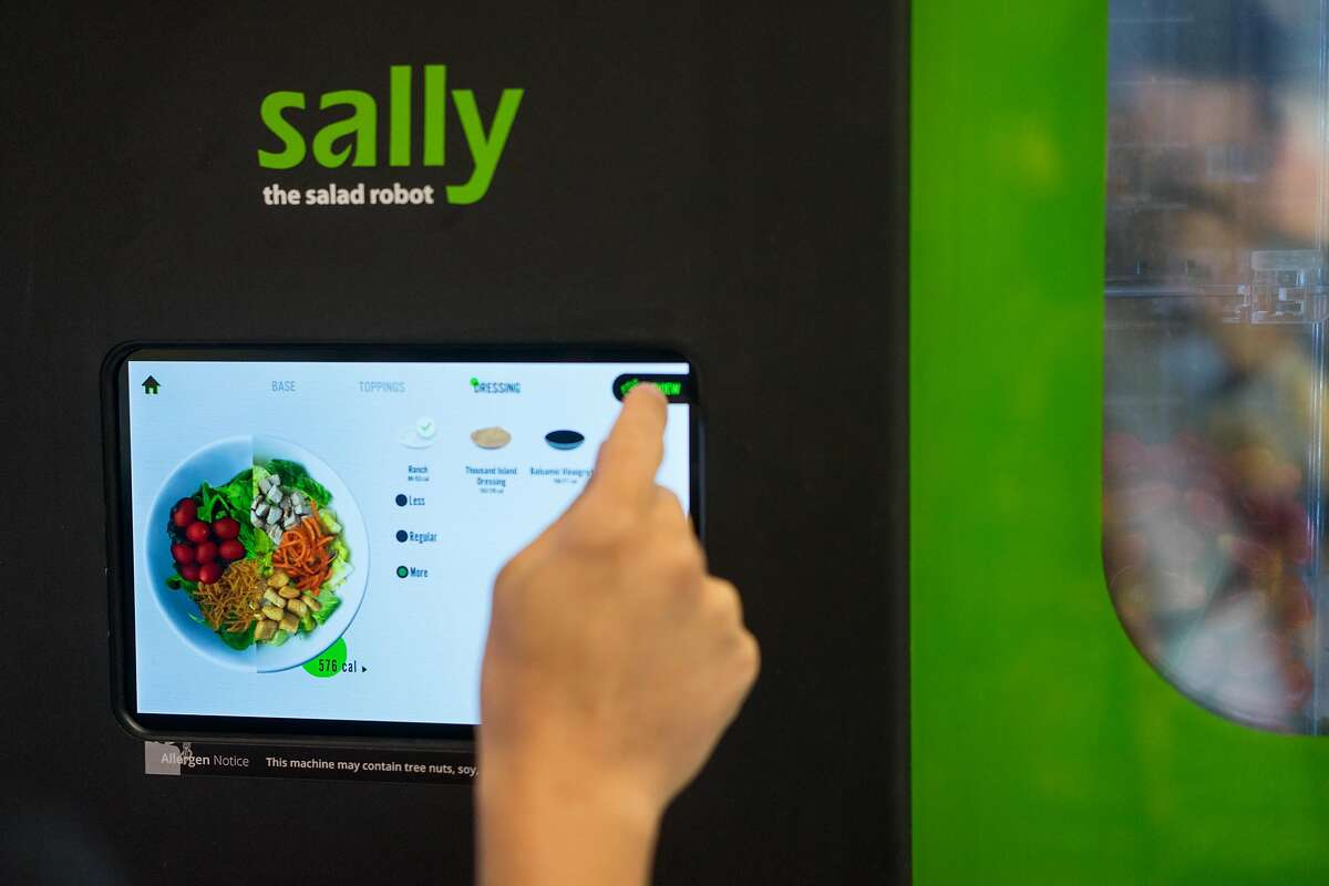 Jose Galvao of Chowbotics demonstrates how Sally, a salad-making robot, prepares salads at the Loop Neighborhood Market in Mountain View, Calif. on Thursday, June 21, 2018. Sally can make custom salads in under one minute.