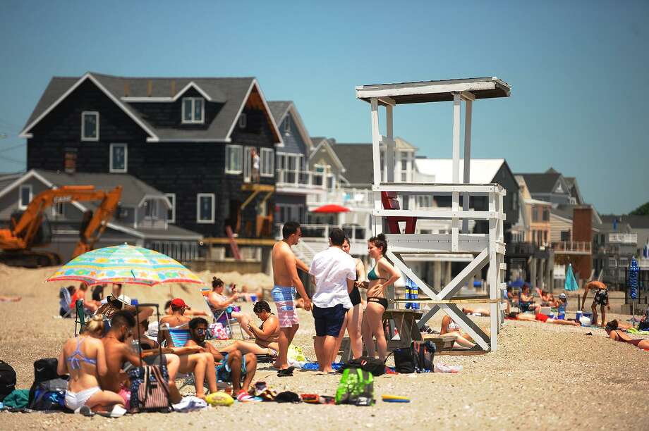 The lifeguard chair sits empty at a busy Silver Sands State Park beach in Milford, Conn. on Tuesday, June 19, 2018. Photo: Brian A. Pounds / Hearst Connecticut Media / Connecticut Post