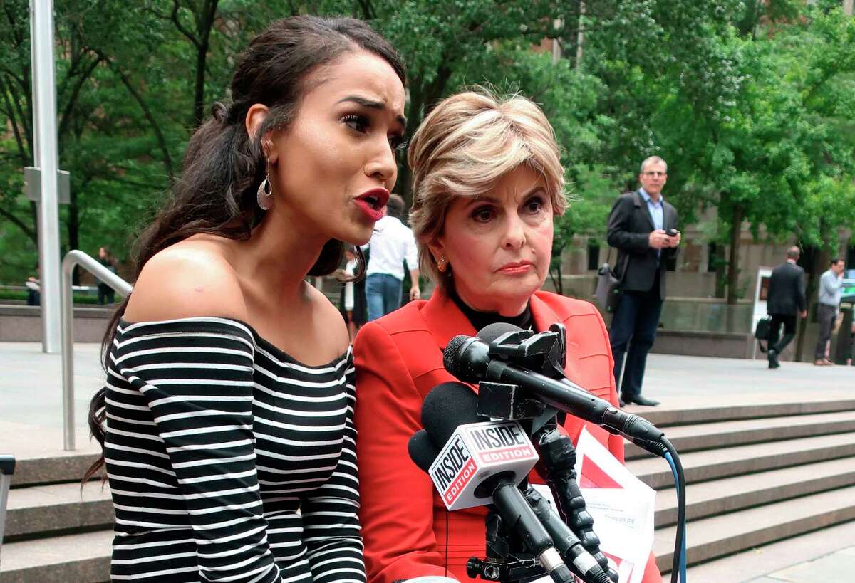 Former Houston Texans cheerleader Angelina Rosa, joined by attorney Gloria Allred, right, speaks during a news conference outside NFL headquarters in New York, Friday, June 22, 2018. Rosa joins five other Texans cheerleaders in a lawsuit alleging the team failed to fully compensate them as required by law and subjected them to hostile work environment in which they were harassed, intimidated and forced to live in fear. (AP Photo/Ted Shaffrey)
