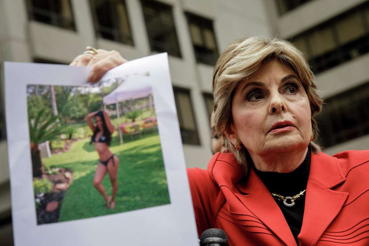 Attorney Gloria Allred holds up a photo of former Houston Texans cheerleader Angelina Rose during a press conference to discuss a lawsuit against the Houston Texans football franchise, outside the headquarters of the National Football League (NFL) in Midtown Manhattan, June 22, 2018 in New York City. The lawsuit alleges that former Houston Texans cheerleader Angelina Rose was body shamed by superiors and forced to duct tape parts of her body during games to make her body appear tighter.
