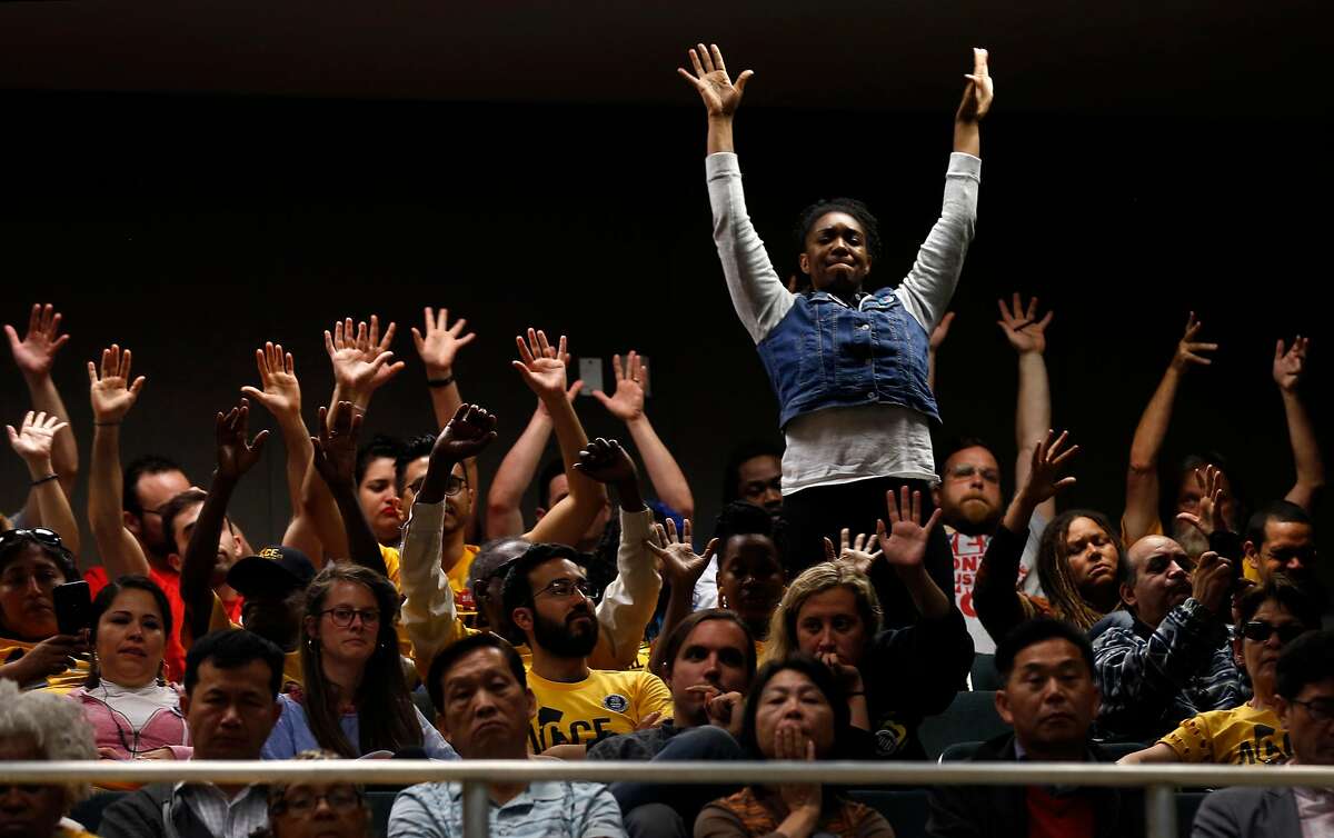 Supporters of tenants rights wave their hands in the air during a joint hearing on the statewide ballot measure to repeal the Costa-Hawkins rental housing act at the State Capitol in Sacramento, Calif. on Thursday, June 21, 2018.