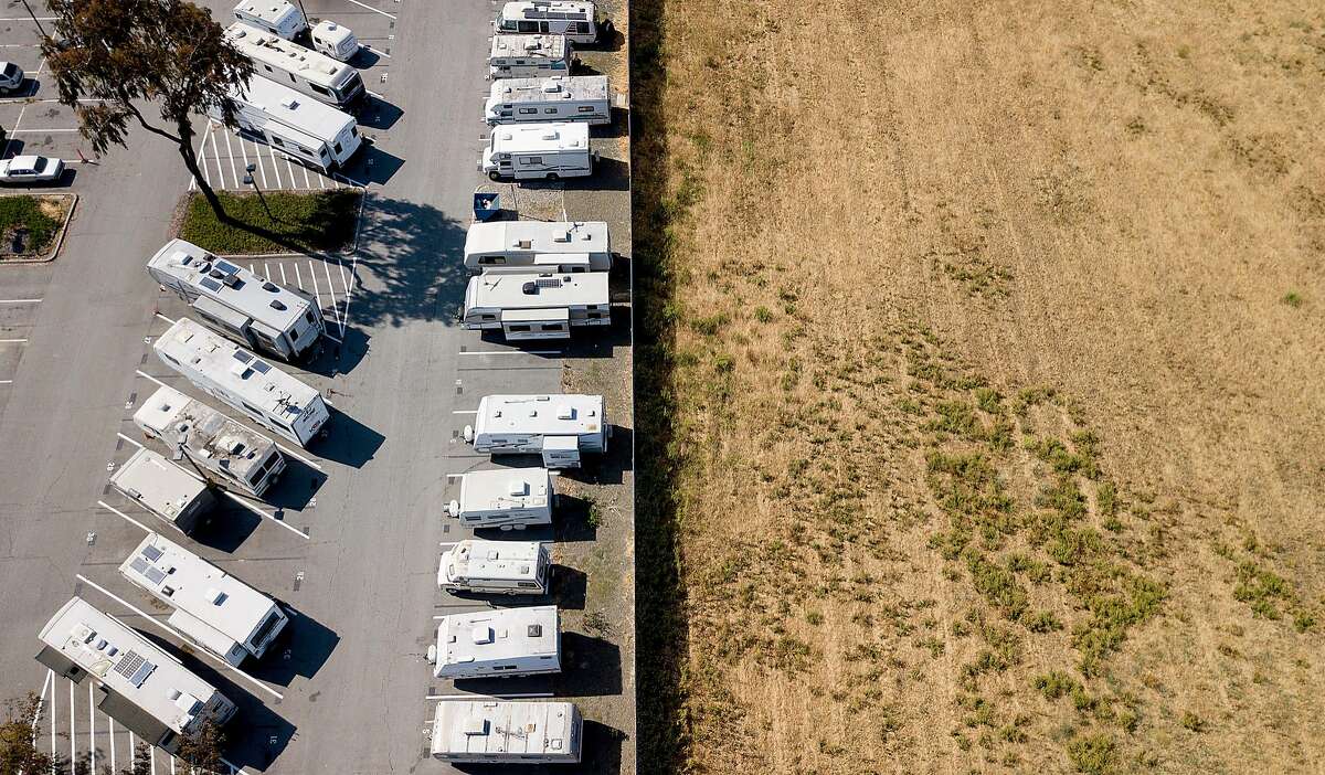 Recreational vehicles line a parking lot at VTA's Cerone bus yard in San Jose, Calif., on Monday, June 18, 2018. The transit agency permits some employees, who have long commutes, to sleep overnight in the lot.
