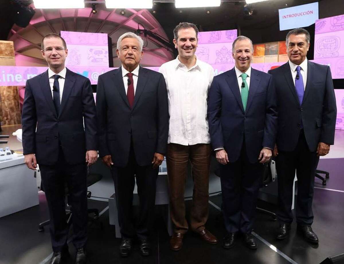 In this photo released by the National Electoral Institute, INE, presidential candidates, from left, Ricardo Anaya with the Forward for Mexico Coalition, Andres Manuel Lopez Obrador with the MORENA party, INE President Lorenzo Cordova Vianello, Jose Antonio Meade with the Institutional Revolutionary Party, and independent candidate Jaime Rodriguez known as “El Bronco,” attend the third and final debate at the Museum of the Mayan World in Merida, Mexico on June 12, 2018. The candidates are generally saying welcoming things about Central American refugees.