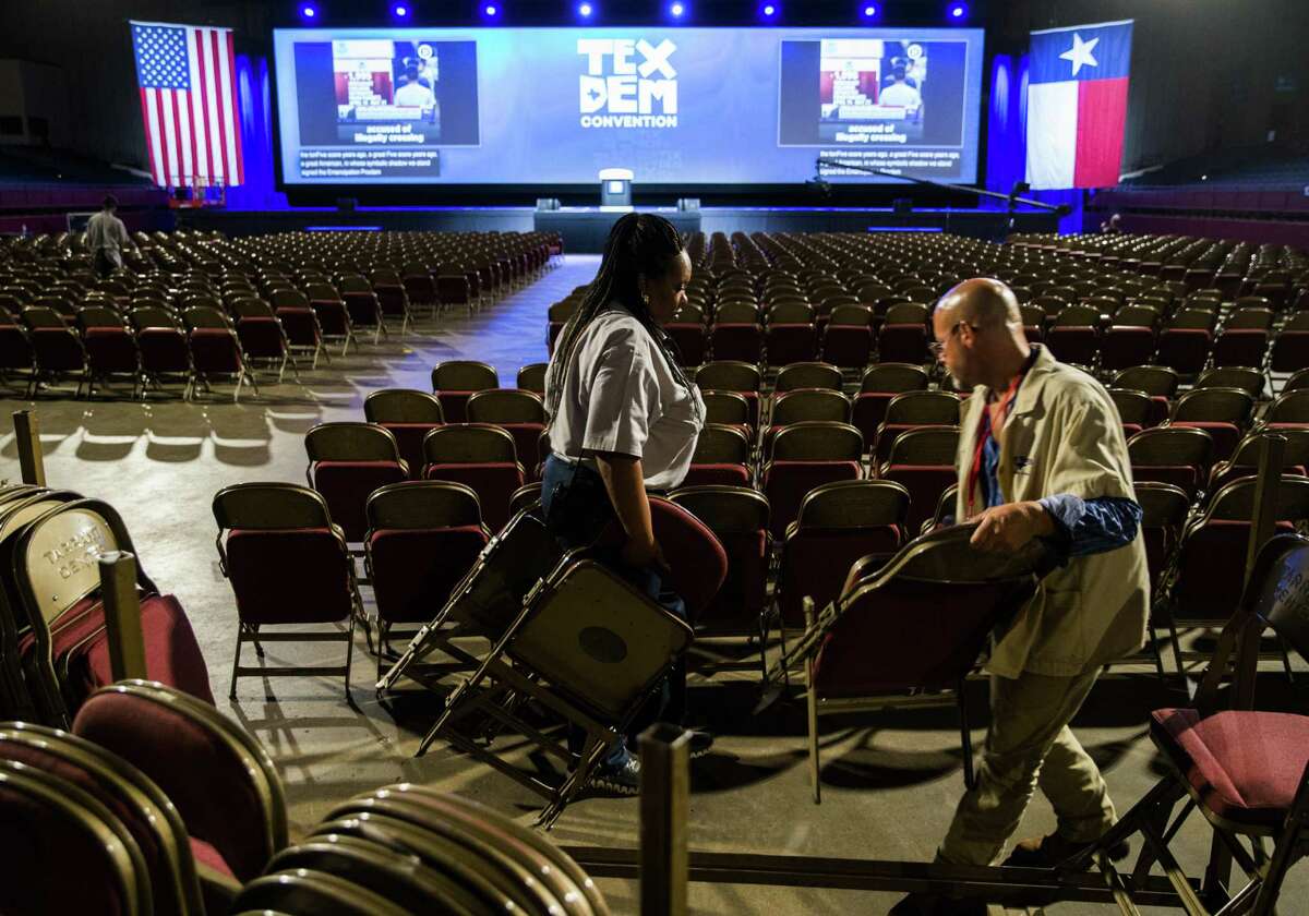 Workers set up chairs in the main arena in preparation for the Texas Democratic Convention on Thursday, June 21, 2018 at the Fort Worth Convention Center in Fort Worth. (Ashley Landis/The Dallas Morning News) ***Note - I was allowed to take photos of the workers, but they were not allowed to give their names.