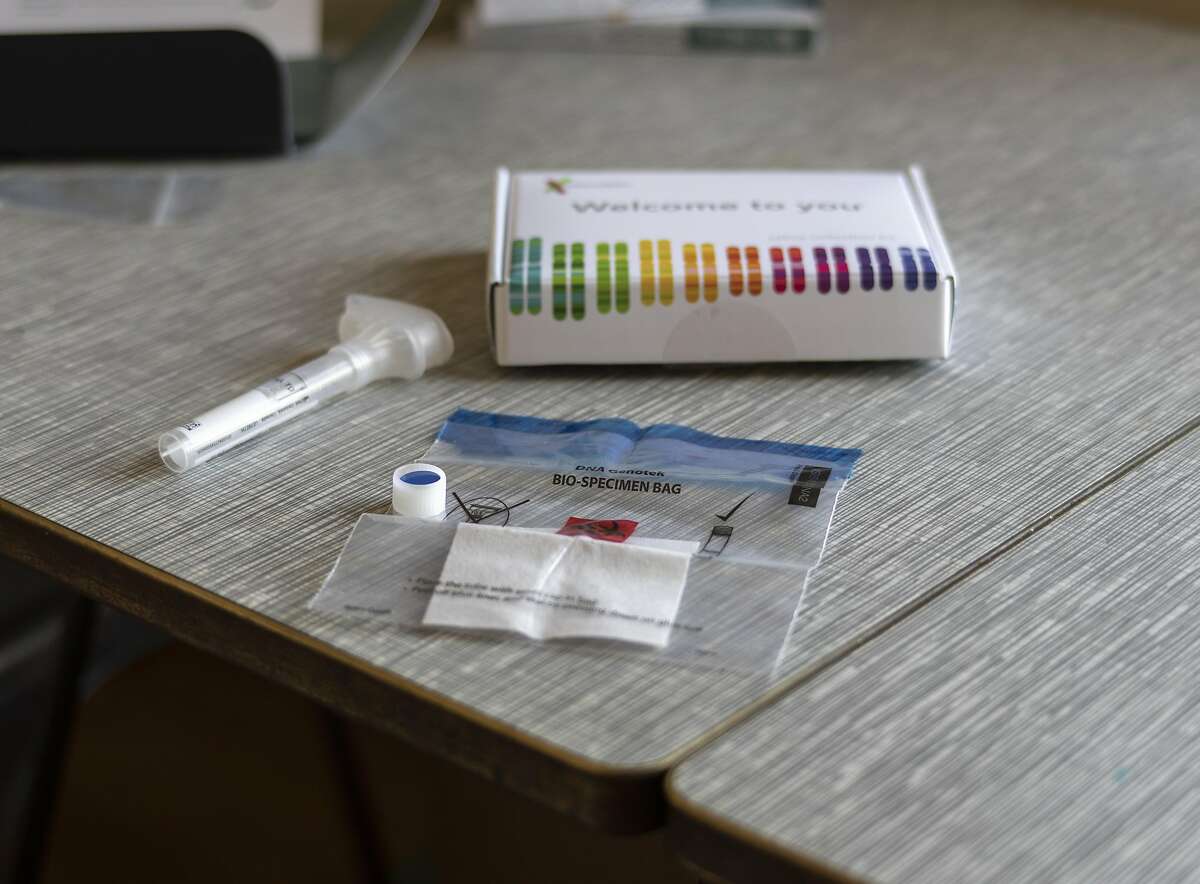 A 23andMe Inc. DNA genetic testing kit is arranged for a photograph in Oakland, California, U.S., on Friday, June 8, 2018. The direct-to-consumer genetic-testing industry has grown from some $15 million in sales in 2010 to more than $99 million in 2017, and is projected to reach $310 million by 2022, according to one industry estimate. Photographer: Cayce Clifford/Bloomberg