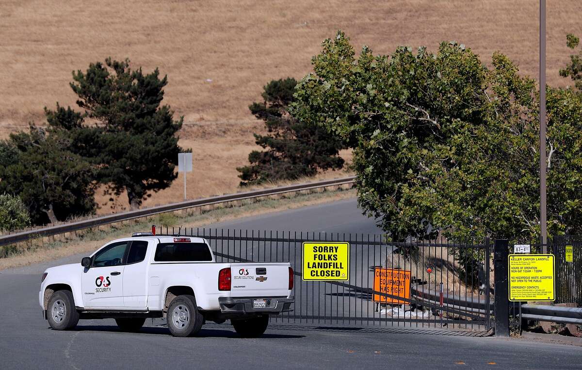 A security vehicle cruises by the closed gates at Keller Canyon Landfill before a community forum hosted by the Contra Costa Environmental Health and County Supervisor Federal Glover at Ambrose Community Center in Bay Point, Calif., on Thursday, June 21, 2018. The forum was held to answer questions about the alleged disposal of potentially radioactive materials from the Hunters Point Naval Shipyard at Keller Canyon Landfill in Bay Point.
