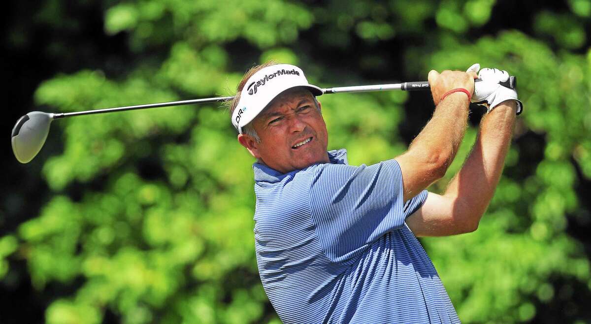 Ken Duke tees off on the 12th hole during the Travelers Championship Pro-Am on June 18, 2014.