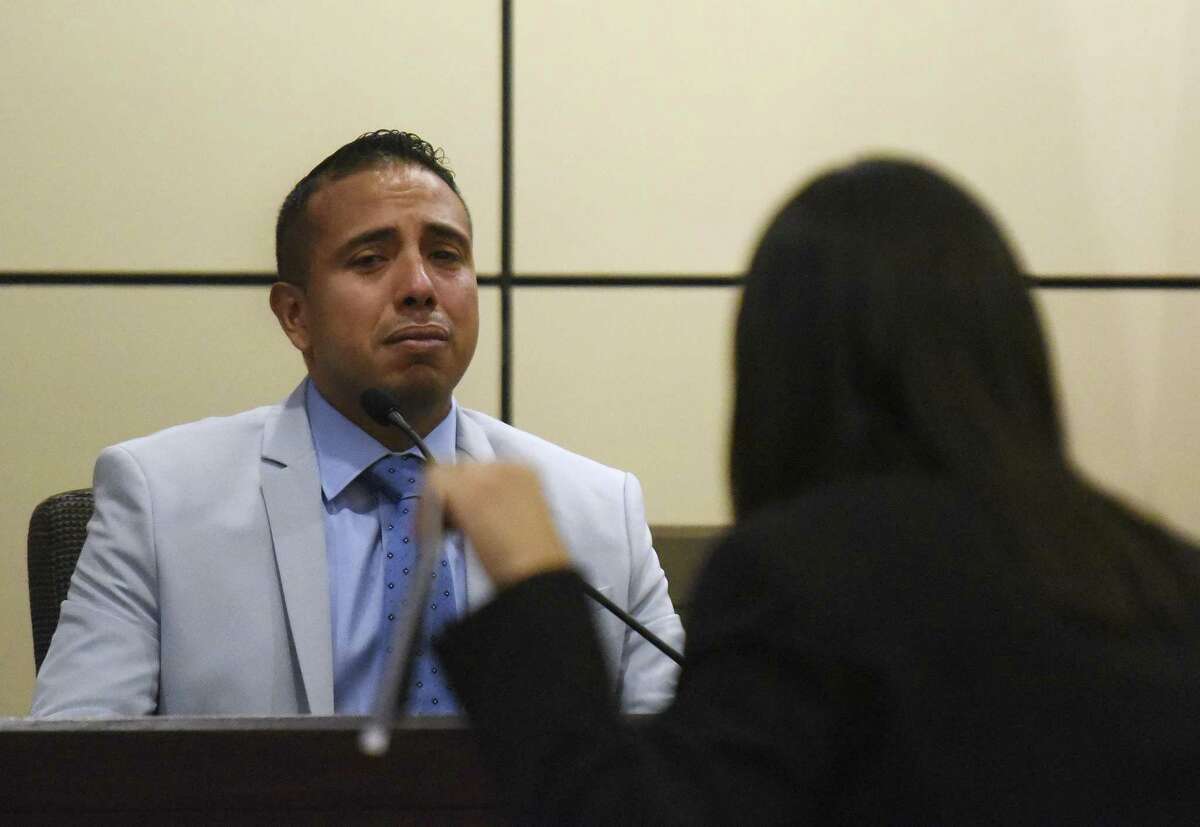 David Asa Villarreal, accused of murder in the fatal stabbing of Aaron Estrada, weeps as prosecutor Kimberly Gonzalez questions him Friday in Judge Jefferson Moore’s courtroom.