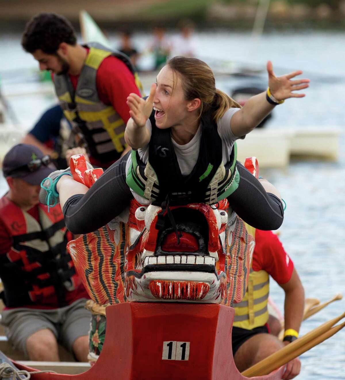 Kendra Williamson reacts as she tries to balance on the end of a dragon boat while grabbing a flag during the annual YMCA Dragon Boat Team Challenge Thursday, Sept. 28, 2017, at Northshore Park in The Woodlands. Under proposed changes to the park use fee waiver process, the YMCA Dragon Boat Races could lose the $4,800 in waived fees in the future. Officials have said if they do lose the waiver, the event will still continue to occur.