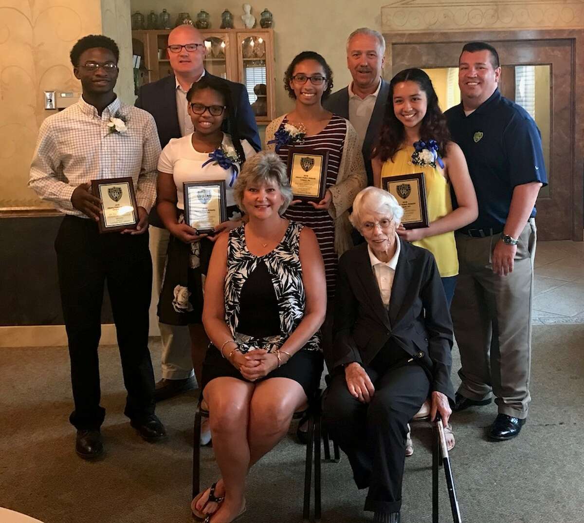 Kayla Huba (center, back row) is the 2018 Art Mitchell/Albany Police Athletic League scholarship winner, and Xavier McCarthy (back row, left) is 2018 Dr. Pat Peterson Community Service Award Winner.