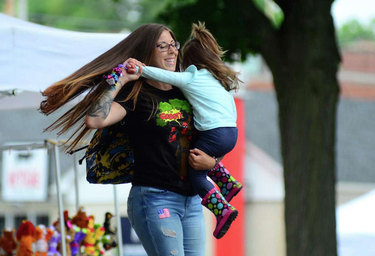 Nicole Meyer, and her daughter Autumn, 2, of Stratford, dance to live music at the Derby Day festival on Elizabeth Street in Derby, Conn., on Saturday June 23, 2018. Some of the highlights included the bands: The Pop Rocks and Creamery Station, various vendors, a performance from the Valley Shakespeare Festival and a duck derby along the Housatonic River. Also, Former Mayor Anita Dugatto helped to collect eyeglasses for the Lions Club Derby Centennial Chapter and brought in a specialist to conduct eye screenings for children up to 12 years old.