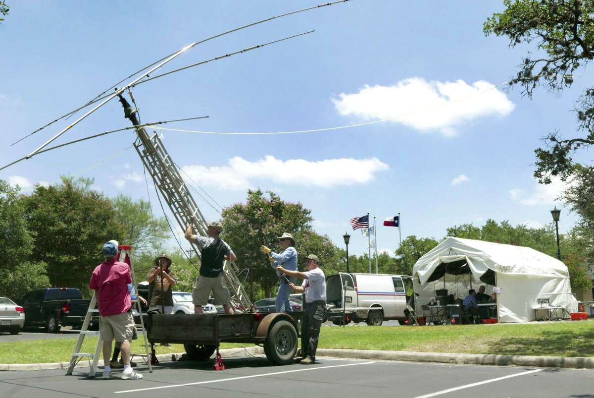 A crew raises a beam antenna during the national Amateur Radio Field Day exercise by members of the San Antonio Radio Club at Shavano Park City Hall on Saturday, June 23, 2018. The public event was designed to educate the public about ham radios and their reliability during natural disasters.