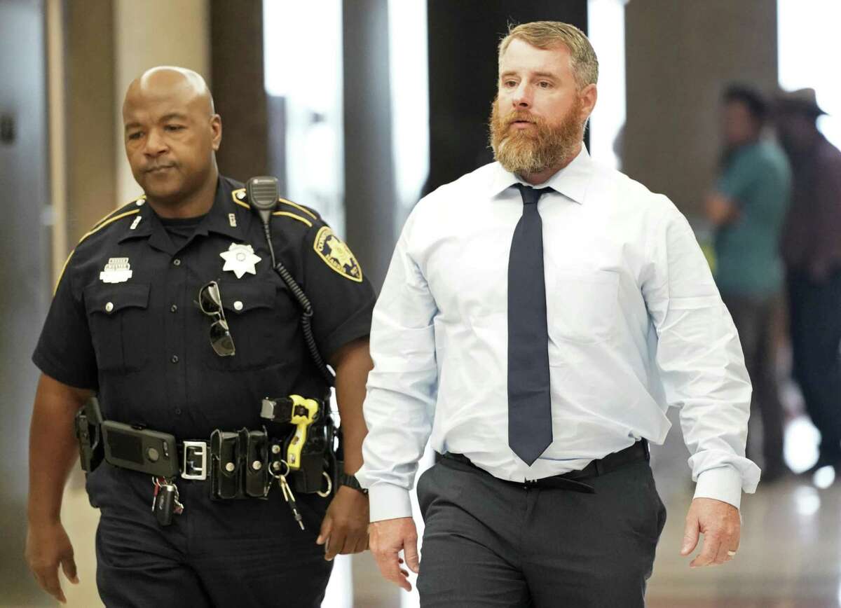 Terry Thompson, accused of fatally choking John Hernandez, is shown being escorted into court as the jury deliberates Saturday, June 23, 2018, in Houston. Terry Thompson was charged with murder in the chokehold death of John Hernandez at a Denny's in May 2017. His wife, Chauna Thompson, who was then a Harris County Sheriff's deputy, is also charged with murder, accused of helping to hold Hernandez down. ( Melissa Phillip / Houston Chronicle ) Saturday, June 23, 2018, in Houston. ( Melissa Phillip / Houston Chronicle )