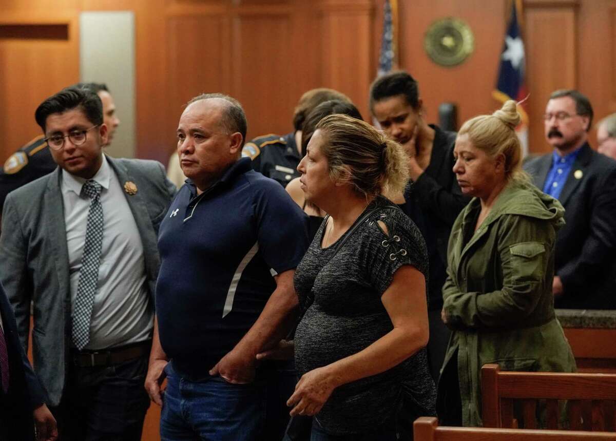 Ignacio Hernandez, center, and his wife, Maria Hernandez, right, the parents of the late John Hernandez and their supporters leave from the court after a mistrial was declared for Terry Thompson, who was accused of fatally choking John Hernandez, shown Saturday, June 23, 2018. Terry Thompson was charged with murder in the chokehold death of John Hernandez at a Denny's in May 2017. His wife, Chauna Thompson, who was then a Harris County Sheriff's deputy, is also charged with murder, accused of helping to hold Hernandez down.